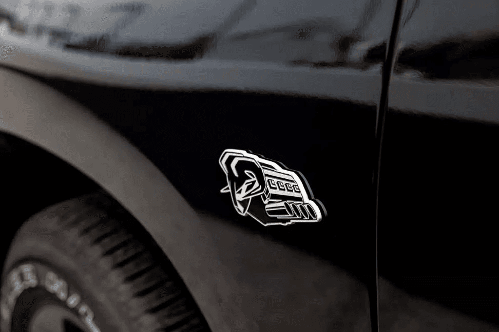 Kromex decorative emblem application on automotive component