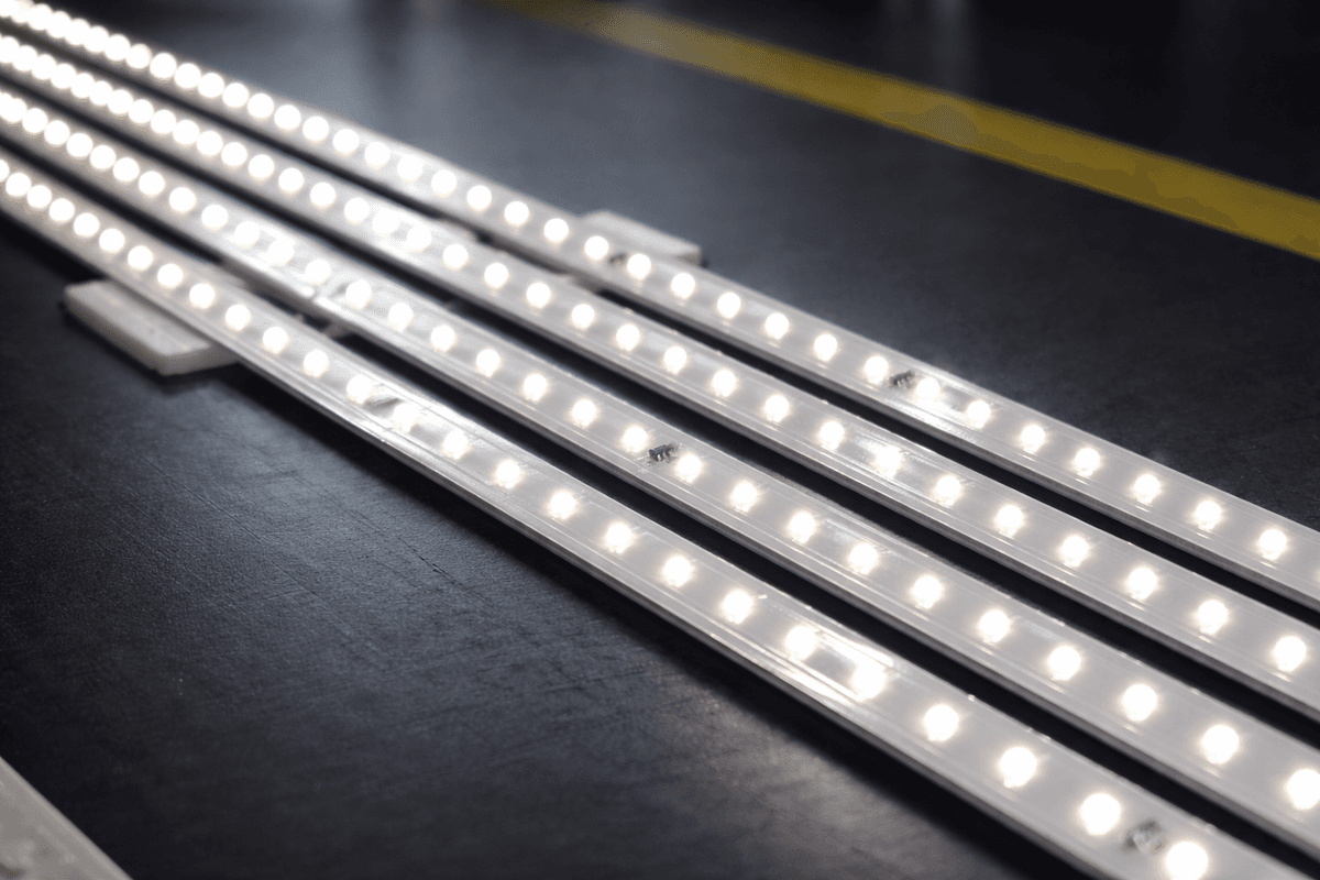 Integrated LED automotive lighting system with blue illumination