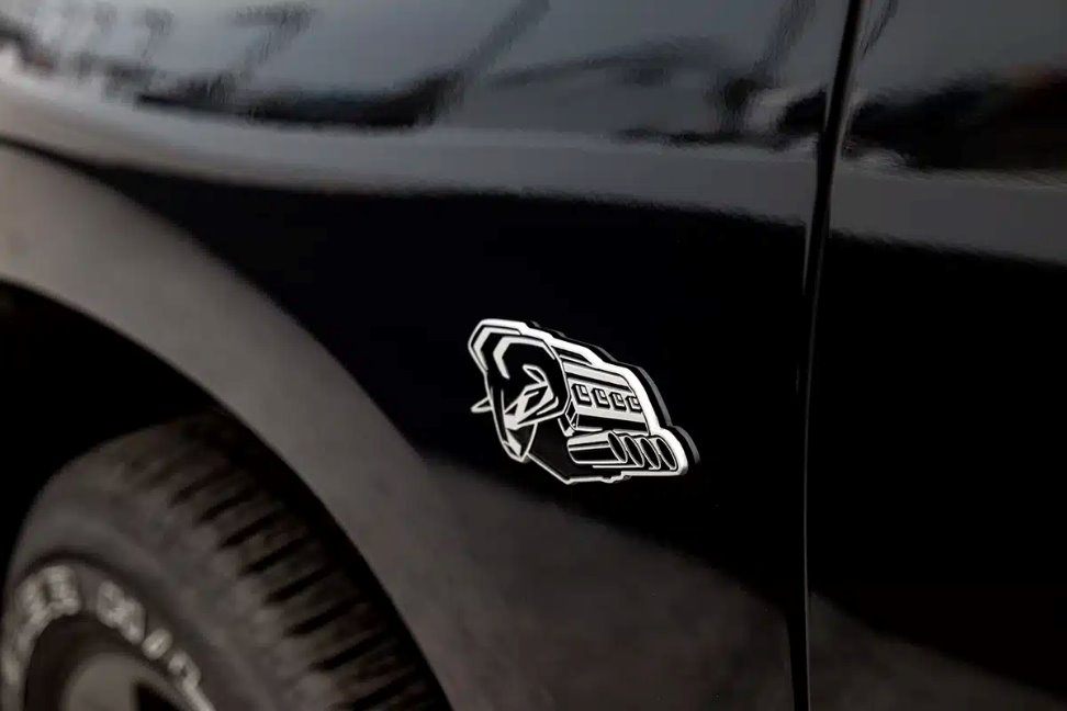 Kromex decorative emblem application on automotive component